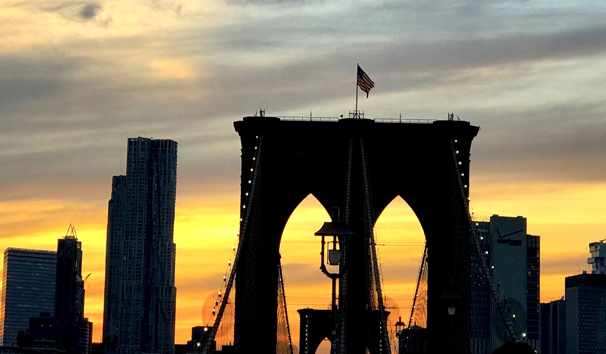 Photo of sunset over Brooklyn Bridge.